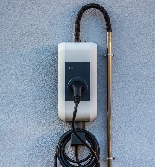 Wallbox on a family house wall for comfortable charging of electric car